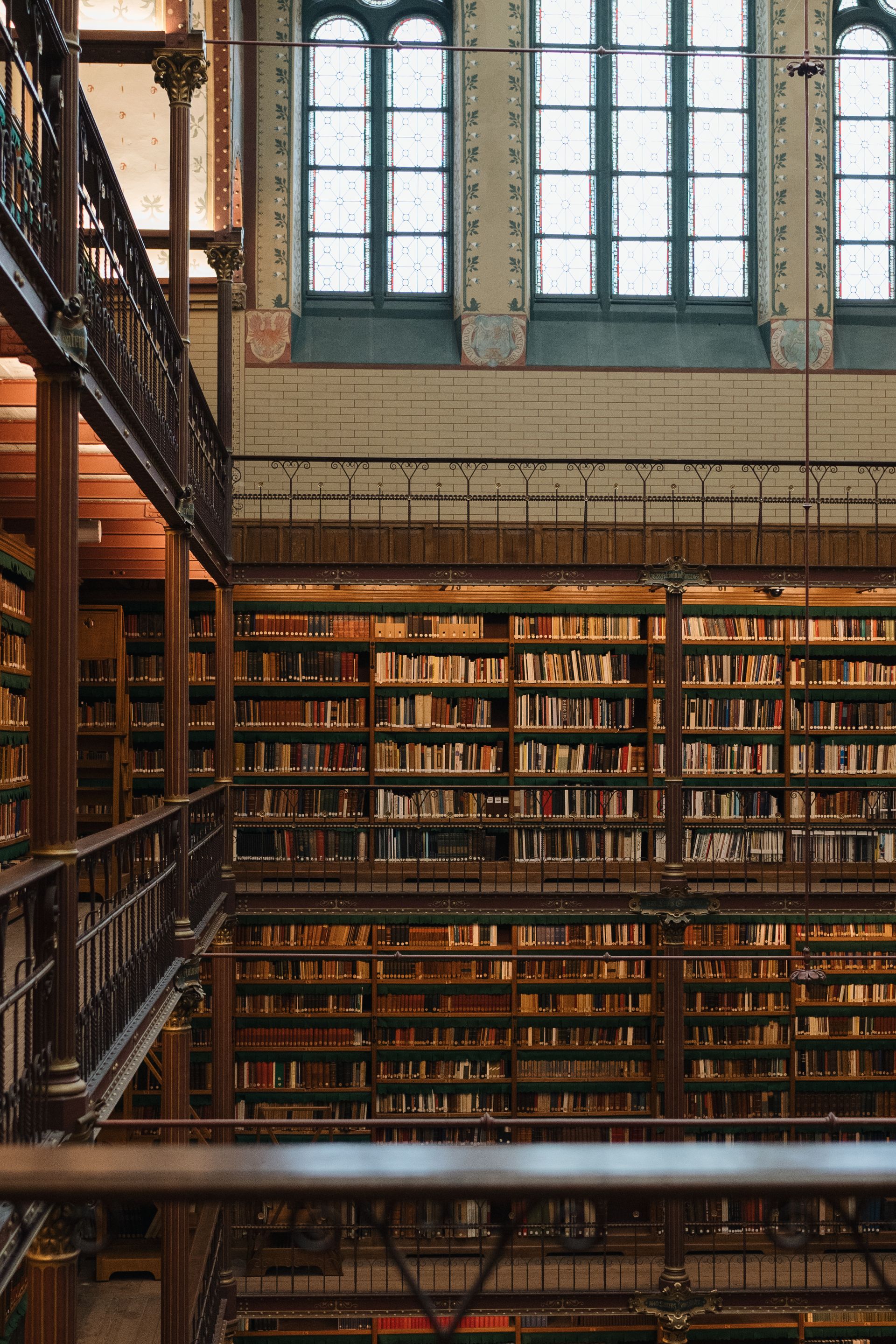 Grand research library with dark wood bookshelves